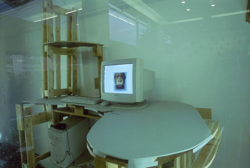 A computer on a desk.