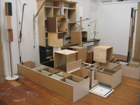 ESSAY by MICHELE MENZIES, 2005
for JASON LINDSAY's exhibition at Special Gallery
Jason Lindsay’s work has tended to repeat itself— both internally, inside a series, and between series. Boxes shadow boxes, and echo other boxes: shelves, tables, slats, speakers, a bunker.