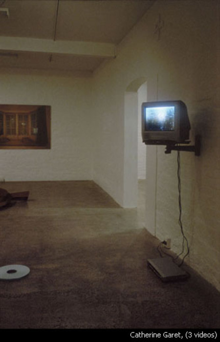 A television screen mounted on a wall.