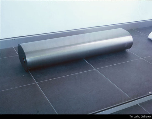 A circular object on tiles.