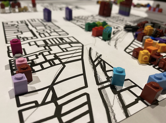 The play pen with blocks on the floors.